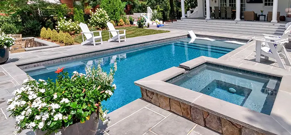 modern pool and spa with white tiles near lounge area built by creative pools and spas